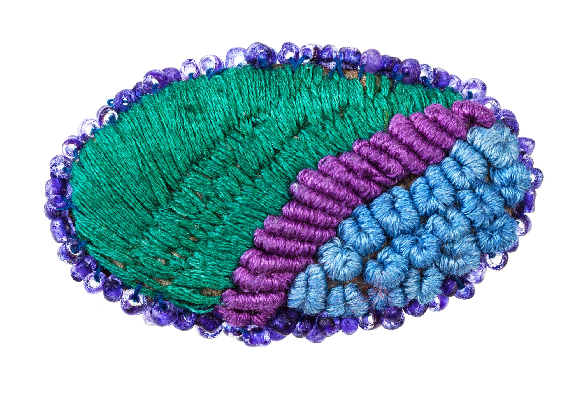 Close-up of colorful embroidered patch on fabric